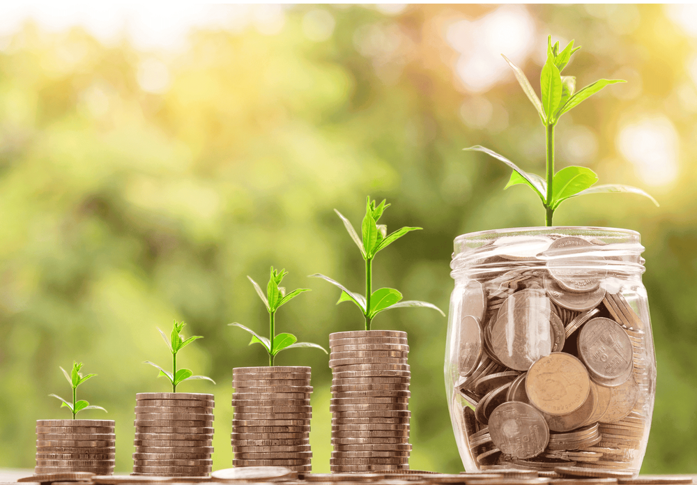A series of jars with increasing amounts of coins and sprouts coming out of the top.